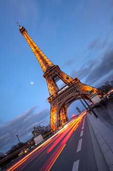 <b>France, Paris</b>, Eiffel tower with car s light tracks