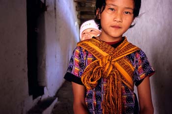 <b>Bhutan, Bumthang</b>, A young mother with child