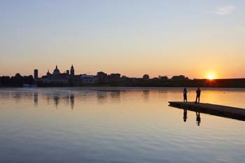 Skyline of the city at sunset reflected in the Mincio river - Mantua - Mantua