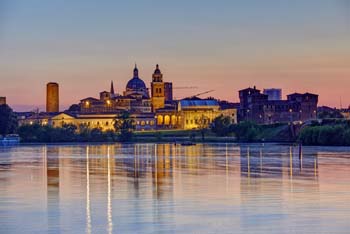 Skyline of the city at sunset reflected in the Mincio river - Mantua - Mantua