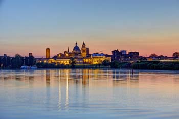 Skyline of the city at sunset reflected in the Mincio river - Mantua - Mantua